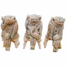 OX BONE CARVED THREE NO FROG ON CHAIR